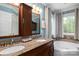 Bathroom with double vanity, granite countertop, and soaking tub at 176 Butch Branch Rd, Union Grove, NC 28689