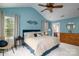 Blue bedroom with a king bed and ceiling fan at 176 Butch Branch Rd, Union Grove, NC 28689