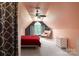 Spacious bedroom with a red bed, window, and ceiling fan at 176 Butch Branch Rd, Union Grove, NC 28689