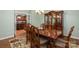 Formal dining room with hardwood floors and china cabinet at 176 Butch Branch Rd, Union Grove, NC 28689