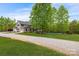 Two story house with a gravel driveway and large yard at 176 Butch Branch Rd, Union Grove, NC 28689