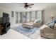 Comfortable living room with light beige sofas and a blue rug at 176 Butch Branch Rd, Union Grove, NC 28689