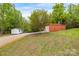 Property features a large red metal building and a smaller shed at 176 Butch Branch Rd, Union Grove, NC 28689