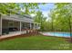 Brick patio with seating area and view of an inground pool at 176 Butch Branch Rd, Union Grove, NC 28689