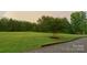 Landscaped yard with a rainbow visible in the background at 176 Butch Branch Rd, Union Grove, NC 28689