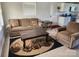 Cozy living room featuring a comfortable sofa, armchair, and view to the kitchen at 1918 Kingston Rd, Kingstown, NC 28150