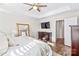 Main bedroom with a large TV, dresser and access to the bathroom at 19510 Deer Valley Dr, Cornelius, NC 28031