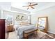 Bright and airy bedroom featuring a king-size bed and large mirror at 19510 Deer Valley Dr, Cornelius, NC 28031