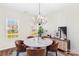 Dining room with round table, chandelier, and hardwood floors at 19510 Deer Valley Dr, Cornelius, NC 28031