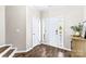 Entryway with hardwood floors, coat closet, and a view to living room at 19510 Deer Valley Dr, Cornelius, NC 28031
