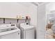Convenient laundry room with washer, dryer, and shelving at 19510 Deer Valley Dr, Cornelius, NC 28031