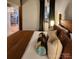 Bedroom with warm color scheme and view into living area at 201 Hoskins Rd # 115, Charlotte, NC 28208