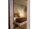 Cozy bedroom with a comfortable bed and warm color scheme at 201 Hoskins Rd # 115, Charlotte, NC 28208
