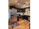 Modern kitchen with stainless steel appliances and dark cabinetry at 201 Hoskins Rd # 115, Charlotte, NC 28208