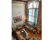 Spacious living room with exposed brick, high ceilings, and hardwood floors at 201 Hoskins Rd # 115, Charlotte, NC 28208