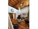 Spacious living room with exposed brick, high ceilings, and hardwood floors at 201 Hoskins Rd # 115, Charlotte, NC 28208