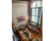 Spacious living room with exposed brick, high ceilings, and hardwood floors at 201 Hoskins Rd # 115, Charlotte, NC 28208