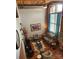 Spacious living room with exposed brick, high ceilings, and hardwood floors at 201 Hoskins Rd # 115, Charlotte, NC 28208