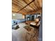 Main bedroom with exposed wood beams and large windows at 201 Hoskins Rd # 115, Charlotte, NC 28208