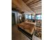 Main bedroom with exposed wood beams and large windows at 201 Hoskins Rd # 115, Charlotte, NC 28208