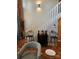 Stylish staircase with white railing and exposed brick wall at 201 Hoskins Rd # 115, Charlotte, NC 28208