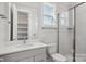 Bathroom featuring modern vanity, framed mirror, and glass shower at 224 Windy Dell Dr, Tega Cay, SC 29708