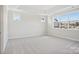 Bedroom with two large windows and neutral colored carpeting at 224 Windy Dell Dr, Tega Cay, SC 29708