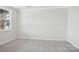 Bedroom with neutral carpet, large window, and ample natural light at 224 Windy Dell Dr, Tega Cay, SC 29708