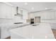 Modern kitchen featuring white cabinets, a large island, and stainless steel appliances at 224 Windy Dell Dr, Tega Cay, SC 29708