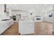 Bright kitchen with a large island, stainless steel appliances, and an open floor plan at 224 Windy Dell Dr, Tega Cay, SC 29708