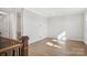 Upstairs loft space with hardwood floors, recessed lighting, and a staircase with oak railing and black spindles at 224 Windy Dell Dr, Tega Cay, SC 29708