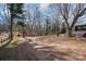 Expansive backyard with mature trees, offering privacy and space for outdoor activities at 2752 Peachtree Rd, Statesville, NC 28625