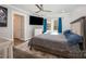 Serene main bedroom with a large bed, wood floors, a ceiling fan, and ample natural light at 2752 Peachtree Rd, Statesville, NC 28625