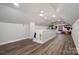 Expansive upstairs bonus room featuring wood floors, multiple ceiling fans, and plenty of space for activities at 2752 Peachtree Rd, Statesville, NC 28625