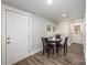Cozy dining area with seating for four, features wood floors and a bright, welcoming atmosphere at 2752 Peachtree Rd, Statesville, NC 28625