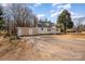 Quaint home with a two-car garage and a driveway, perfect for parking and curb appeal at 2752 Peachtree Rd, Statesville, NC 28625