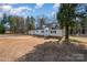 Charming one-story home with a well-manicured front yard and mature trees at 2752 Peachtree Rd, Statesville, NC 28625