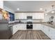 Bright kitchen featuring granite countertops, stainless steel appliances, white cabinetry, and wood flooring at 2752 Peachtree Rd, Statesville, NC 28625