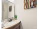Bathroom with granite countertops, modern fixtures, and decorative wall art at 311 Kaitlyn Ln, Kings Mountain, NC 28086