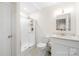 Bright bathroom featuring a shower, white vanity, and modern fixtures at 311 Kaitlyn Ln, Kings Mountain, NC 28086