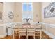 Elegant dining room with large window, wood floors, and stylish decor at 311 Kaitlyn Ln, Kings Mountain, NC 28086