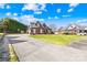 Brick home with a well-maintained front lawn and long driveway at 311 Kaitlyn Ln, Kings Mountain, NC 28086
