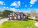 Beautiful brick home showcasing a well-manicured lawn and classic architectural details at 311 Kaitlyn Ln, Kings Mountain, NC 28086