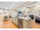 Open-concept kitchen with island bar, stainless appliances, connecting to living area at 311 Kaitlyn Ln, Kings Mountain, NC 28086