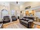Spacious living room featuring hardwood floors, high ceilings, and comfortable leather seating at 311 Kaitlyn Ln, Kings Mountain, NC 28086
