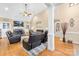 Bright living room with fireplace, hardwood floors, and lots of natural light at 311 Kaitlyn Ln, Kings Mountain, NC 28086