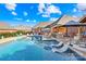 Stunning backyard featuring a large pool, outdoor kitchen, and cozy lounge area, perfect for entertaining at 311 Kaitlyn Ln, Kings Mountain, NC 28086