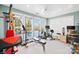 Bright workout room features lots of natural light and exercise equipment at 311 Kaitlyn Ln, Kings Mountain, NC 28086