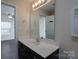 Bathroom with vanity, mirror, and access to bedroom at 3809 Carl Parmer Dr, Harrisburg, NC 28075