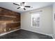 Bedroom with dark floors and an accent wall at 3809 Carl Parmer Dr, Harrisburg, NC 28075